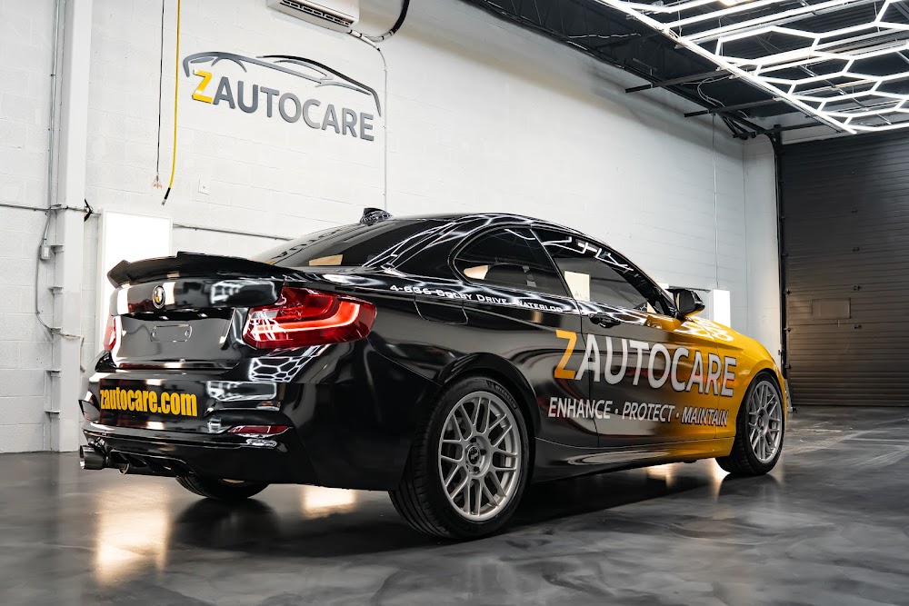 Rear three-quarter of the ZAutoCare branded car in the studio