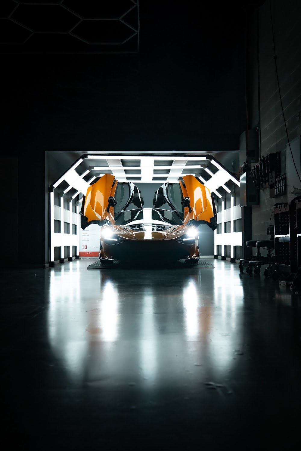 McLaren 720S rear glowing in ZAutoCare's tunnel lighting