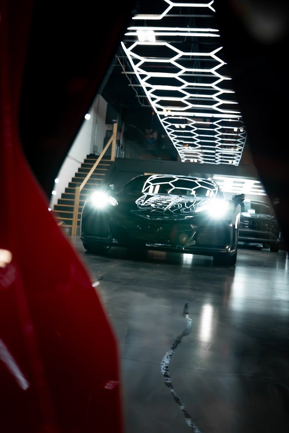 C8 Z06 with headlights on inside the studio