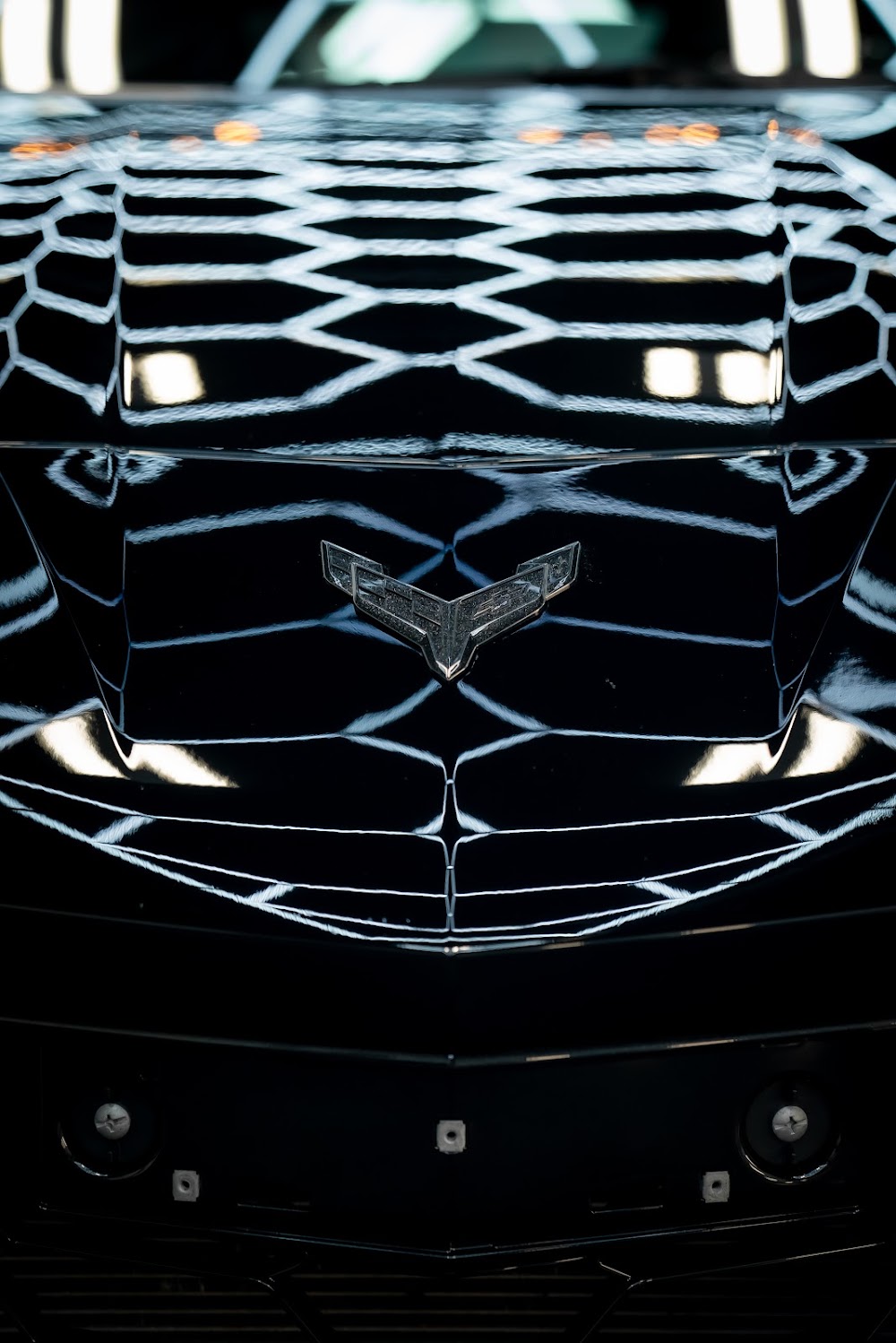 Z06 hood vents and crossed-flags badge detail