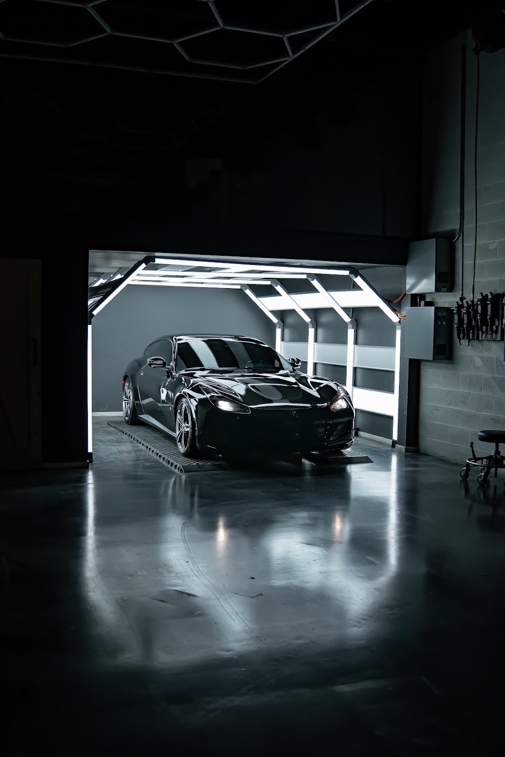 Black Ferrari GTC4Lusso in ZAutoCare's light tunnel