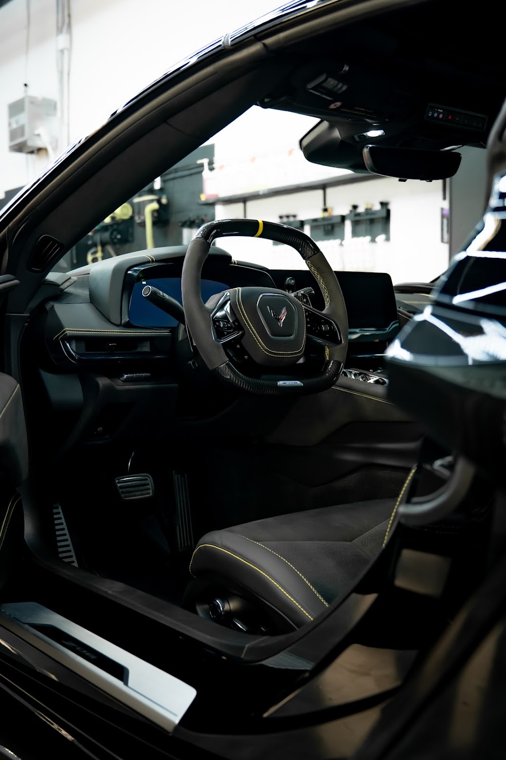 C8 Z06 interior with yellow seatbelts and accents
