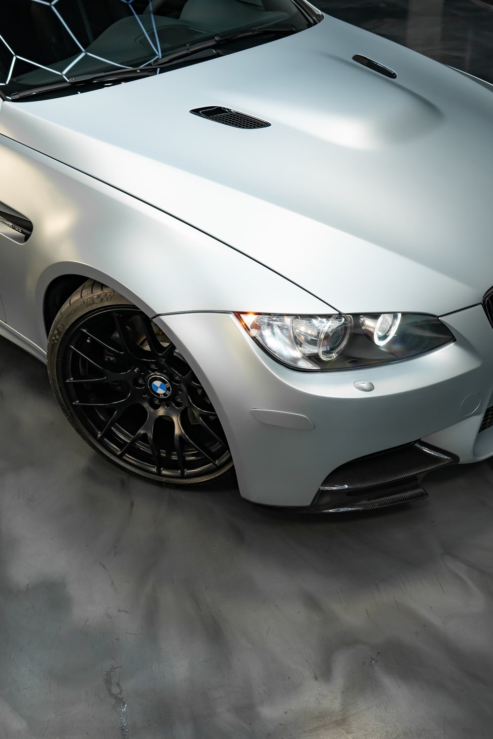 Silver BMW M3 with carbon splitter after a Full Workz detail at ZAutoCare