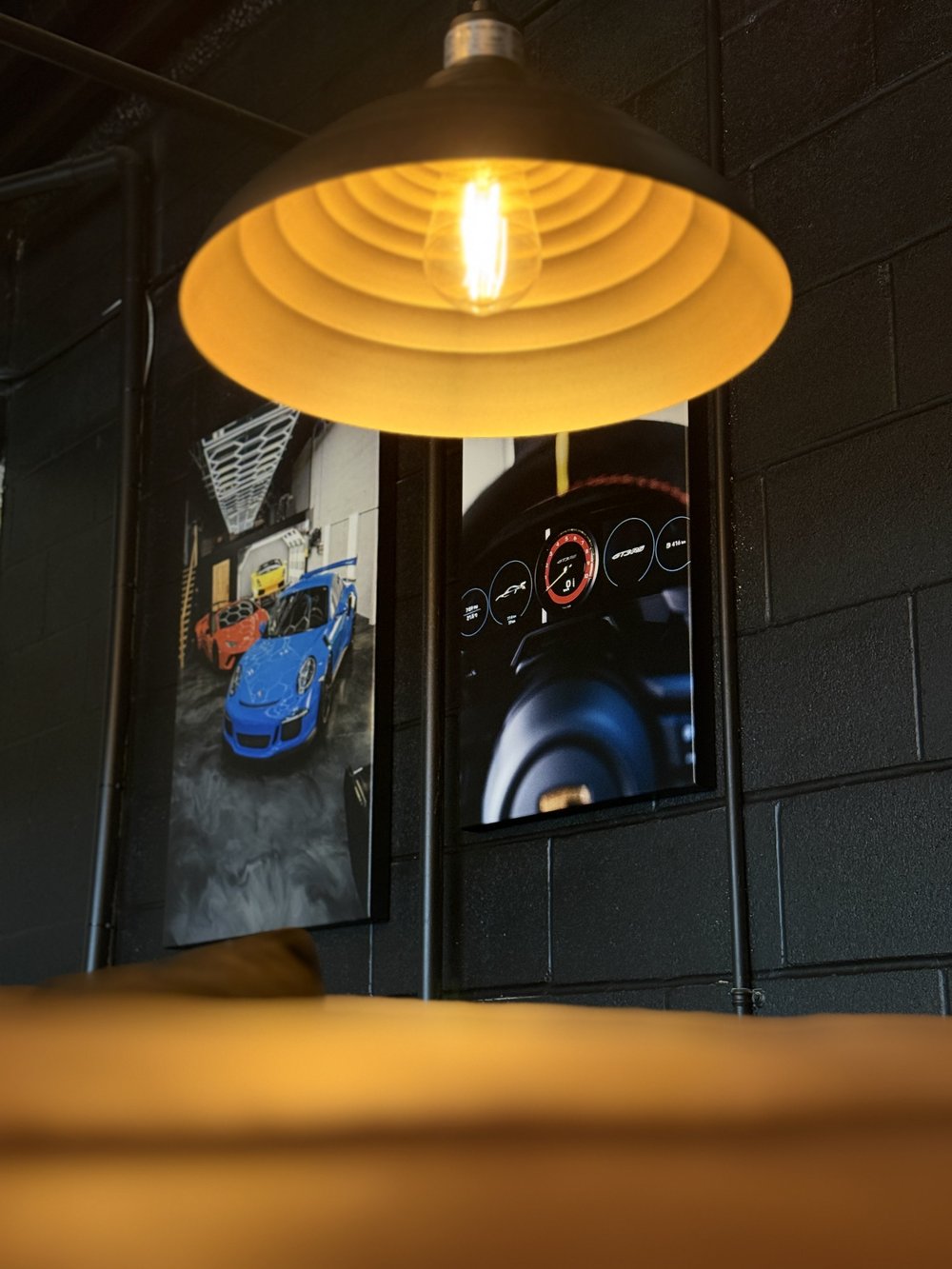 ZAutoCare lounge seating with automotive canvas art on the wall
