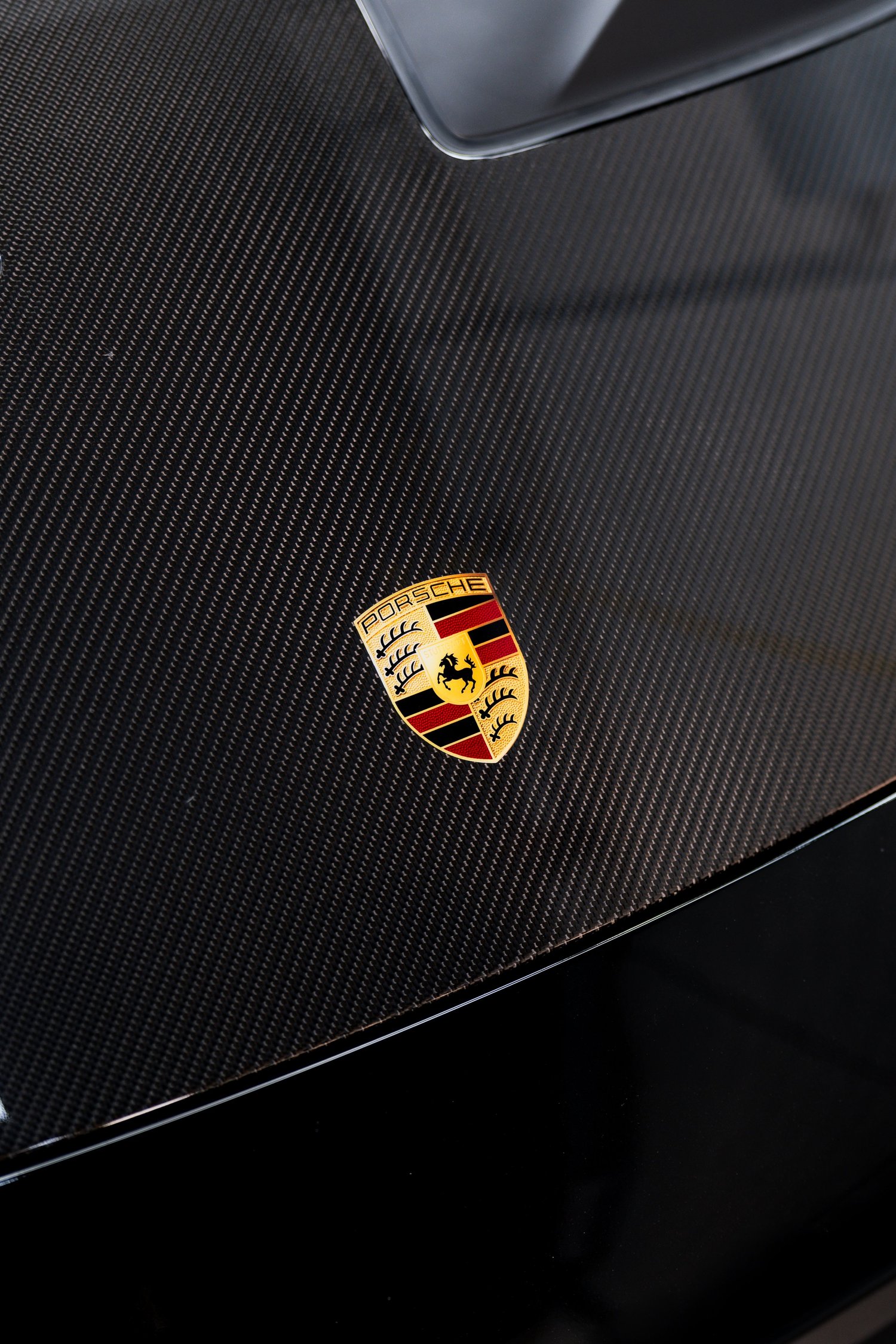 Close-up of a carbon fibre hood on a 992 Porsche GT3 RS protected with XPEL PPF