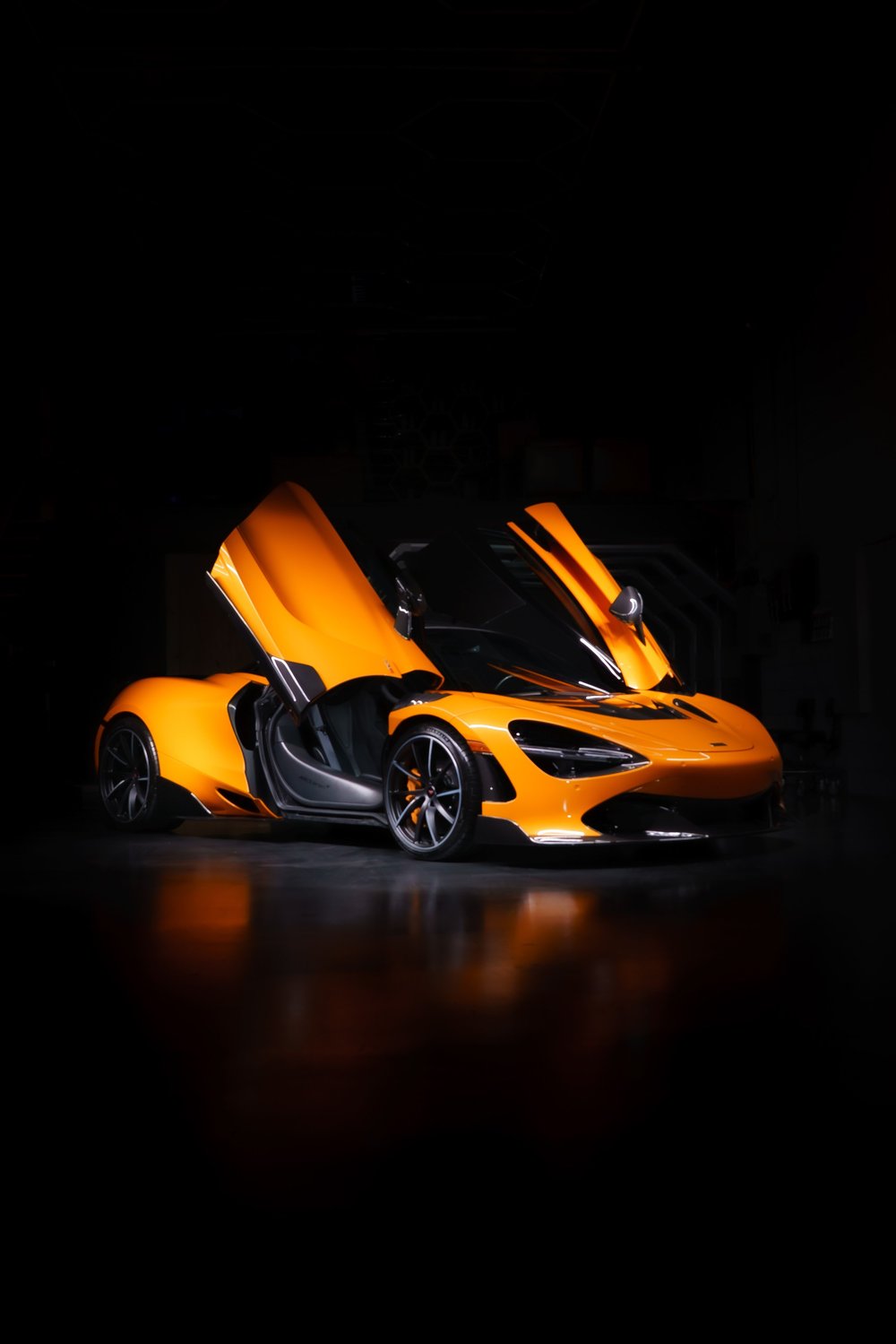 McLaren 720S in the signature McLaren pose at ZAutoCare