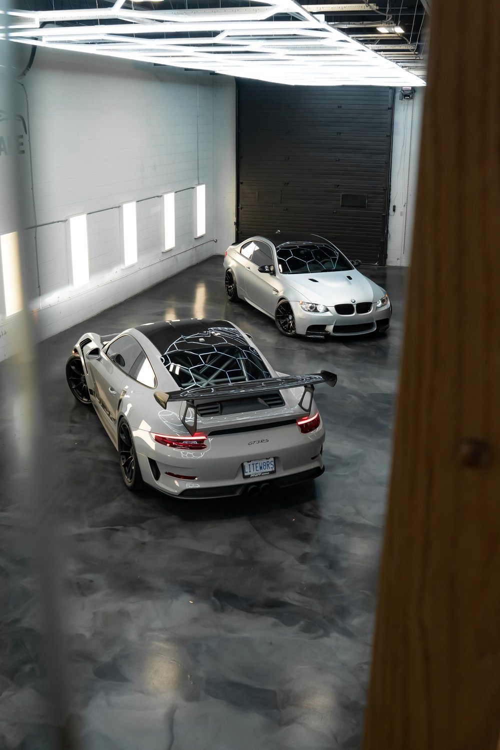 Porsche 911 GT3 RS and BMW M3 parked inside ZAutoCare