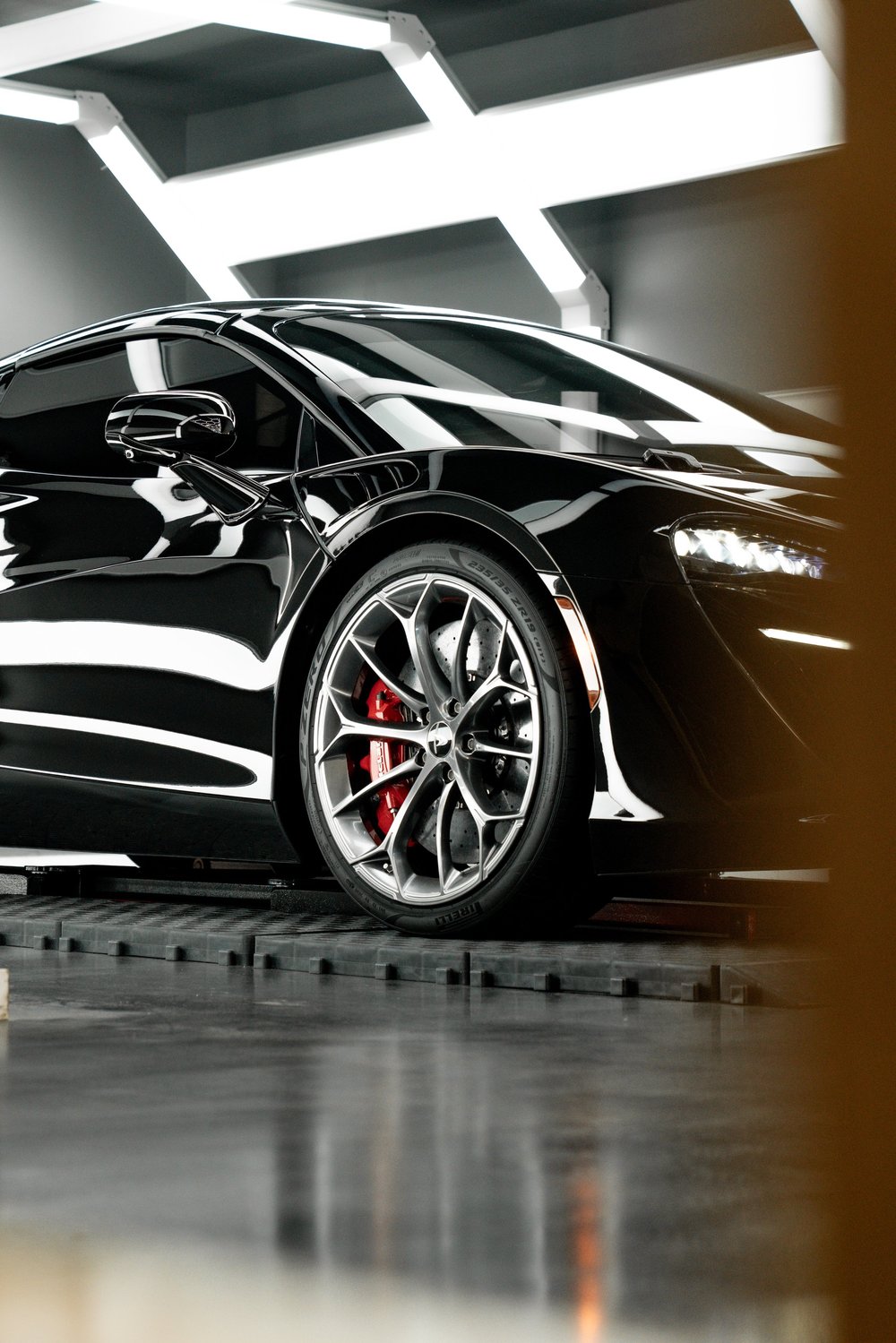 Wheel of a McLaren Artura after paint correction, PPF and ceramic coating
