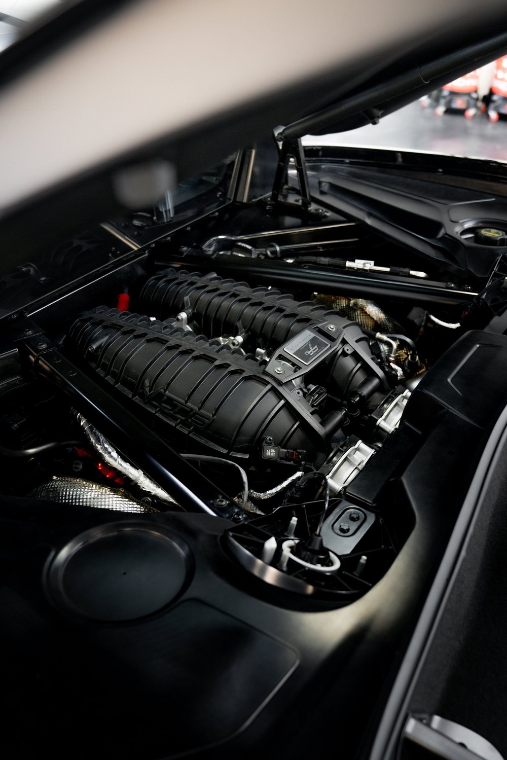 Detailed engine bay of a C8 Chevrolet Corvette Z06 at ZAutoCare
