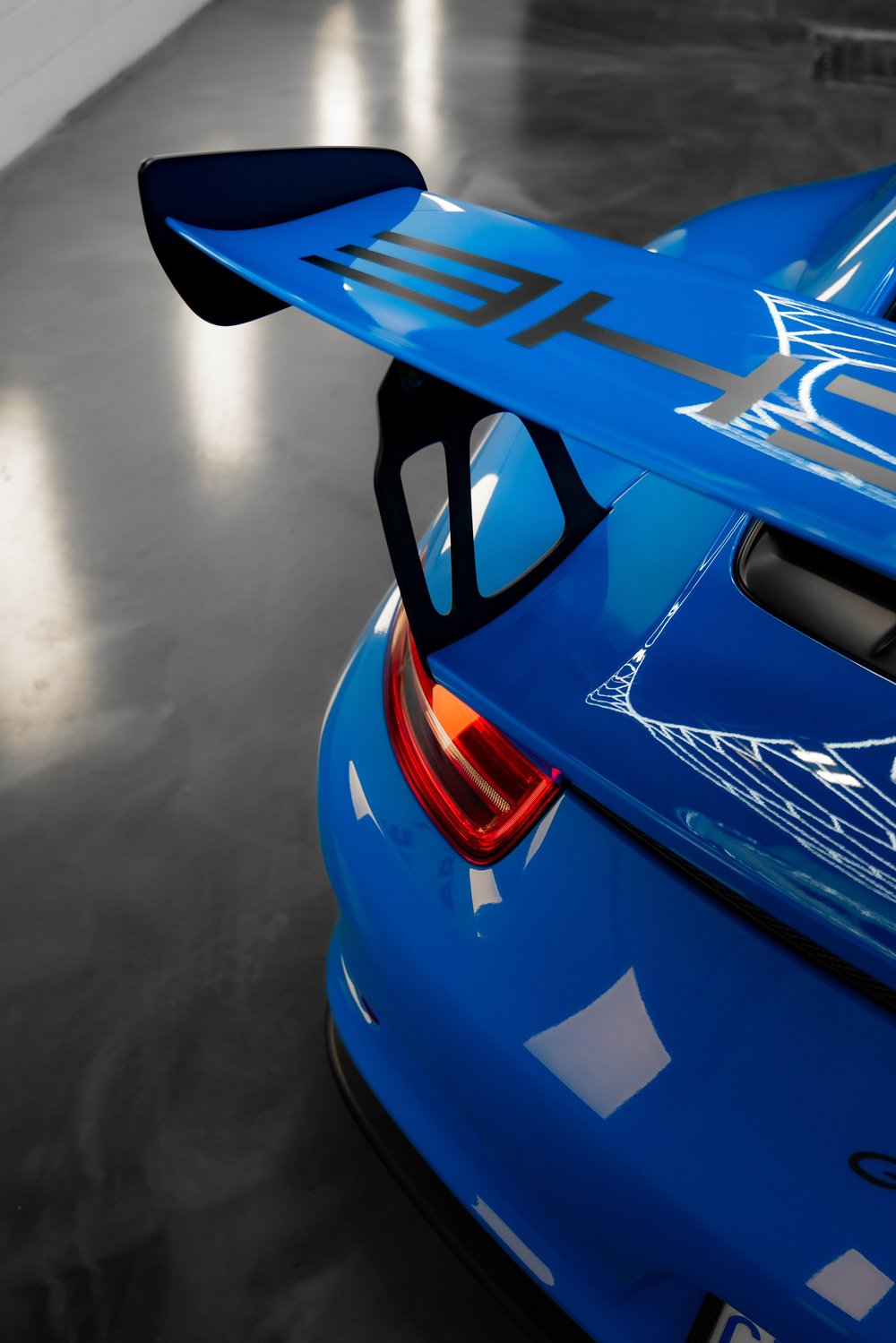 Blue Porsche 911 GT3 RS wing inside ZAutoCare