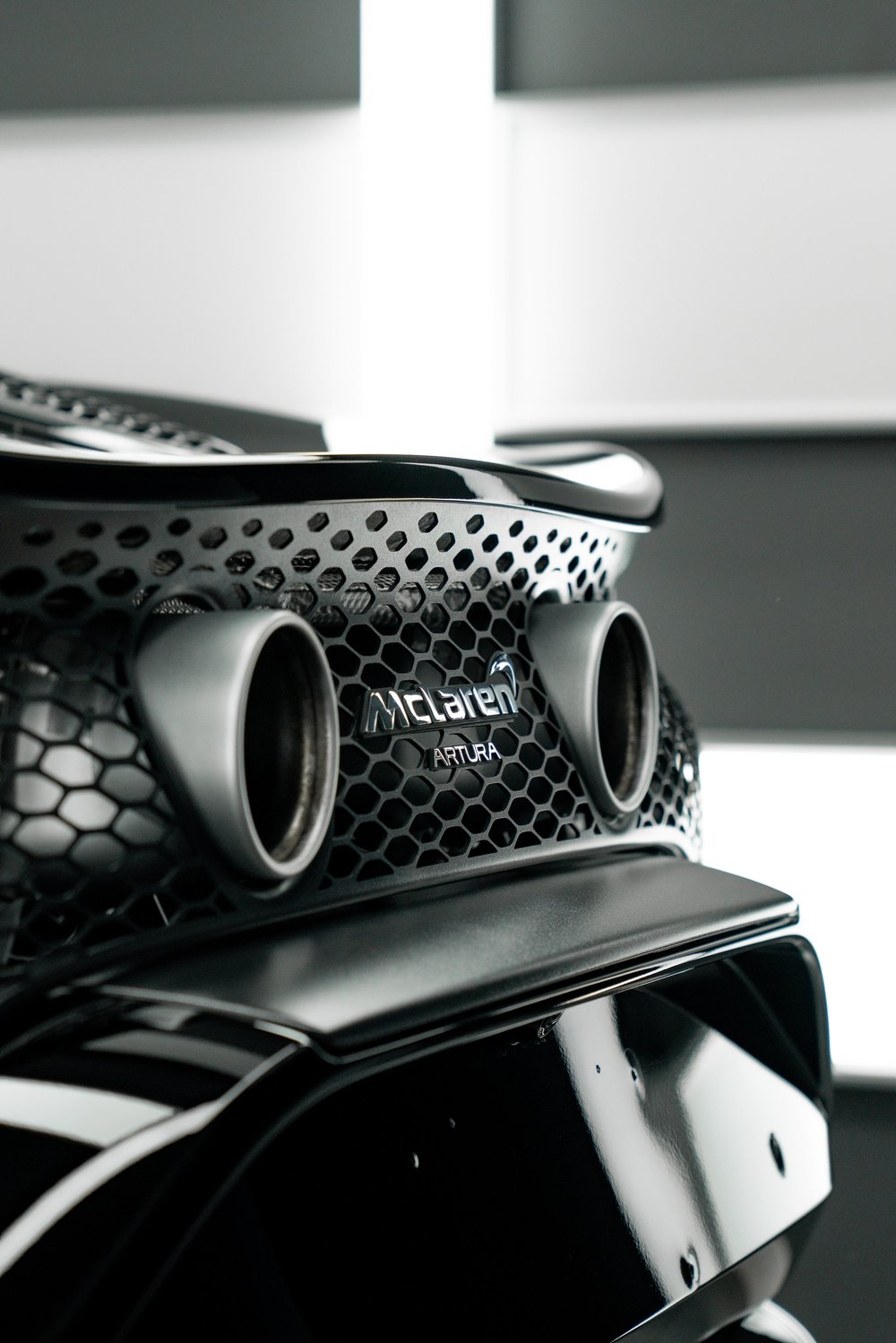 Exhaust pipes of a McLaren Artura curing at ZAutoCare