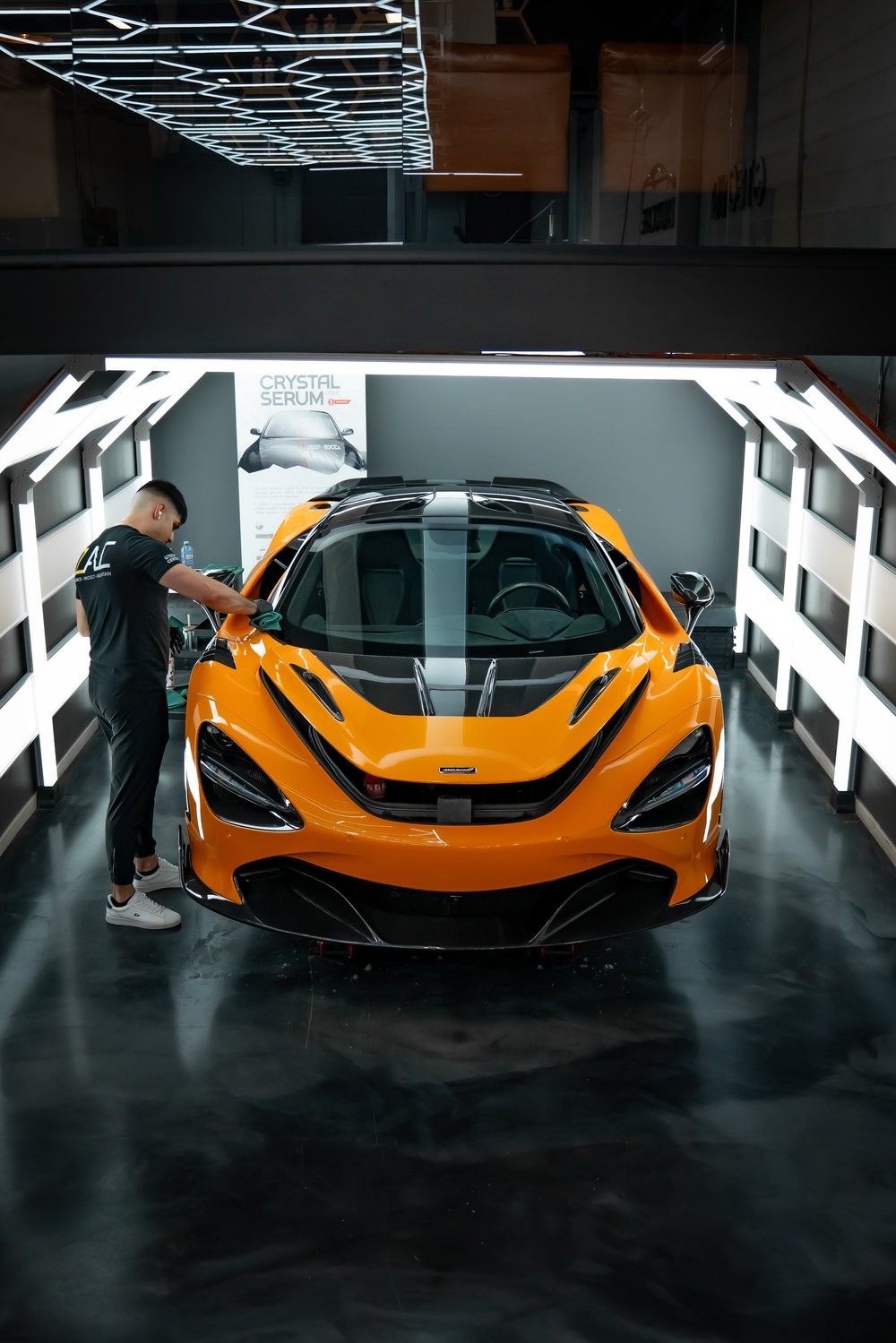 ZAutoCare technician applying Gtechniq ceramic coating to a McLaren 720S