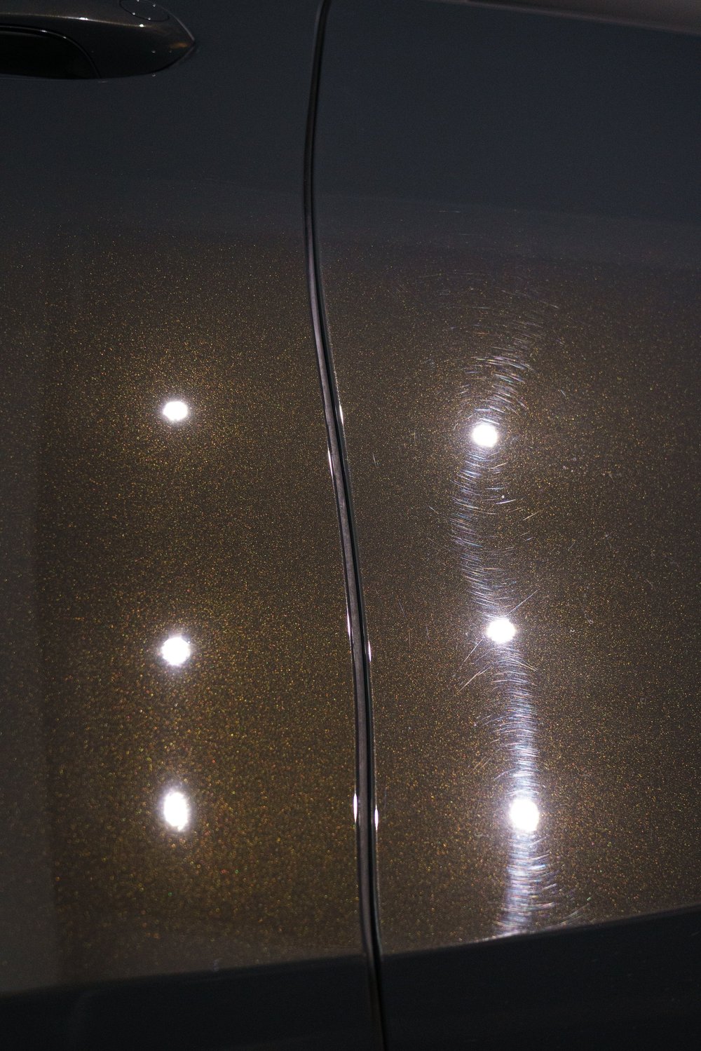 BMW X6M Competition mid paint correction under inspection lighting